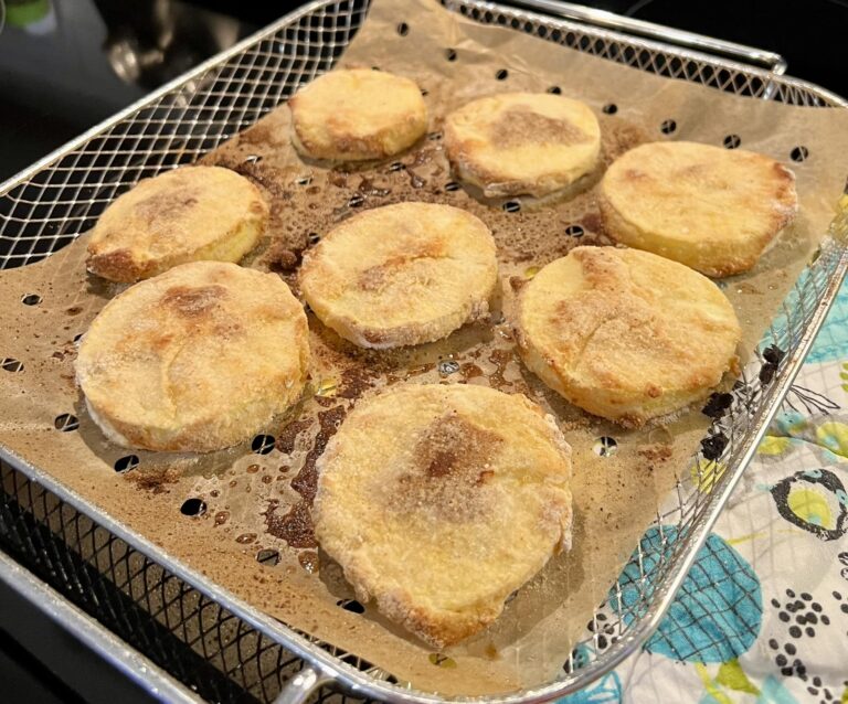 Coating yellow squash in a cornmeal and buttermilk breading.