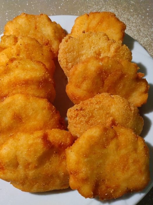 Hand-formed cornmeal patties ready to be fried for Hot Water Cornbread