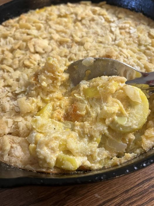 Real, unedited photograph of a baked vegetable casserole with crackers